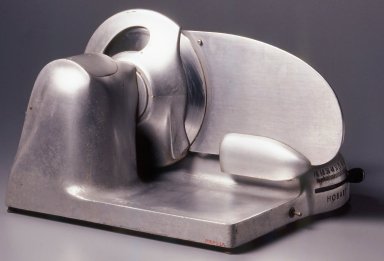 Egmont Arens (American, 1887–1966). <em>Meat Slicer</em>, ca. 1935. Steel, aluminum, rubber, electrical wiring, 12 1/2 x 17 x 20 1/2 in. (31.8 x 43.2 x 52.1 cm). Brooklyn Museum, Gift of Eva, Alan, and Louis Brill, 1998.143.3a-b. Creative Commons-BY (Photo: Brooklyn Museum, CUR.1998.143.3a-b_back.jpg)