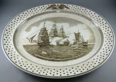 Josiah Wedgwood & Sons Ltd. (founded 1759). <em>Platter, Old Ironsides</em>, ca. 1938. Glazed earthenware, 2 x 19 x 15 5/8 in.  (5.1 x 48.3 x 39.7 cm). Brooklyn Museum, Gift of Jason and Susanna Berger, 1999.103.31. Creative Commons-BY (Photo: Brooklyn Museum, CUR.1999.103.31.jpg)