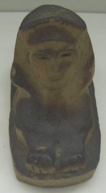 Unknown. <em>Sphinx-Shaped Doorstop</em>, 20th century. Glazed earthenware, 5 x 3 3/4 x 8 3/4 in. (12.7 x 9.5 x 22.2 cm). Brooklyn Museum, Gift of Paul F. Walter, 1999.108.11. Creative Commons-BY (Photo: Brooklyn Museum, CUR.1999.108.11_front.jpg)