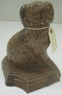 Unknown. <em>Dog-Shaped Doorstop</em>, 19th or 20th century. Glazed earthenware, 9 1/2 x 8 x 6 1/2 in. (24.1 x 20.3 x 16.5 cm). Brooklyn Museum, Gift of Paul F. Walter, 1999.108.13. Creative Commons-BY (Photo: Brooklyn Museum, CUR.1999.108.13_back.jpg)