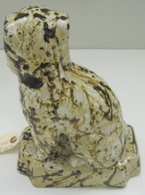 Unknown. <em>Dog-shaped Doorstop</em>, 19th or 20th century. Glazed earthenware, 10 1/2 x 7 3/4 x 4 1/2 in. (26.7 x 19.7 x 11.4 cm). Brooklyn Museum, Gift of Paul F. Walter, 1999.108.4. Creative Commons-BY (Photo: Brooklyn Museum, CUR.1999.108.4_back.jpg)