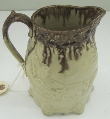 Unknown. <em>Pitcher</em>, 19th century. Glazed earthenware, 6 1/2 x 5 3/4 x 3 1/2 in. (16.5 x 14.6 x 8.9 cm). Brooklyn Museum, Gift of Paul F. Walter, 1999.108.9. Creative Commons-BY (Photo: Brooklyn Museum, CUR.1999.108.9.jpg)
