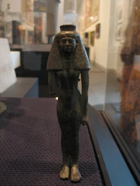  <em>A God's Wife of Amun</em>, ca. 760-656 B.C.E. Bronze, 7 5/8 x 2 1/8 x 1 3/8 in. (19.4 x 5.4 x 3.5 cm). Brooklyn Museum, Gifts in memory of Christos G. Bastis and Charles Edwin Wilbour Fund, 1999.110. Creative Commons-BY (Photo: Brooklyn Museum, CUR.1999.110_diverseworks.jpg)