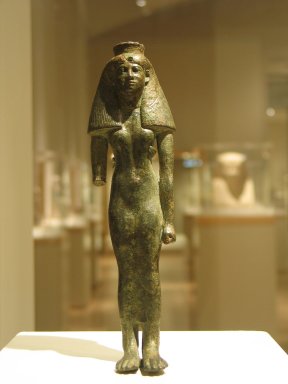  <em>A God's Wife of Amun</em>, ca. 760-656 B.C.E. Bronze, 7 5/8 x 2 1/8 x 1 3/8 in. (19.4 x 5.4 x 3.5 cm). Brooklyn Museum, Gifts in memory of Christos G. Bastis and Charles Edwin Wilbour Fund, 1999.110. Creative Commons-BY (Photo: Brooklyn Museum, CUR.1999.110_wwg8.jpg)
