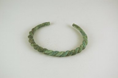 Inland Niger Delta. <em>Bracelet</em>, 200–1000 C.E.?. Copper alloy, 1/2 x 5 x 3 7/16 in.  (1.3 x 12.7 x 8.7 cm). Brooklyn Museum, Gift of Drs. John I. and Nicole Dintenfass, 1999.131.1. Creative Commons-BY (Photo: Brooklyn Museum, CUR.1999.131.1_PS5.jpg)