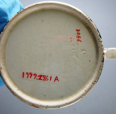 William Till (?). <em>Cup and Saucer</em>, ca. 1880. Glazed earthenware, height: 2 3/4 in. (7.0 cm). Brooklyn Museum, Gift of Paul F. Walter, 1999.29.61a-b. Creative Commons-BY (Photo: Brooklyn Museum, CUR.1999.29.61a_mark.jpg)