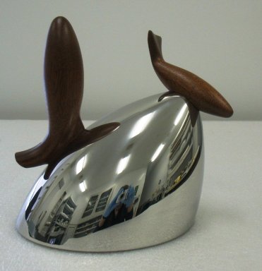 Frank Gehry (American, born 1929). <em>Kettle, 'Pito' Model 90031</em>, Designed 1988. Stainless steel and mohogany, 7 3/16 x 9 1/4 x 8 3/8 in.  (18.2 x 23.5 x 21.2 cm). Brooklyn Museum, Gift of Alessi S.p.A., 1999.40.13a-b. Creative Commons-BY (Photo: Brooklyn Museum, CUR.1999.40.13a-b_view1.jpg)