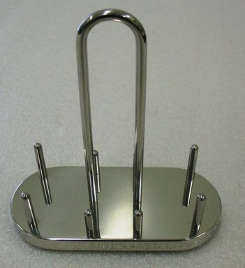 Ettore Sottsass Jr. (Italian, born Austria, 1917-2007). <em>Stand</em>, Designed 1978. Stainless steel, 17.5 x 3.5 cm. Brooklyn Museum, Gift of Alessi S.p.A., 1999.40.21. Creative Commons-BY (Photo: Brooklyn Museum, CUR.1999.40.21.jpg)