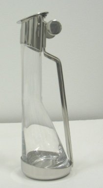 Achille Castiglioni (Italian, 1918-2002). <em>Oil Bottle with Frame, Model 90004/0</em>, Designed 1984. Stainless steel and crystal, height: (23.5 cm); width: (7.5 cm). Brooklyn Museum, Gift of Alessi S.p.A., 1999.40.50. Creative Commons-BY (Photo: Brooklyn Museum, CUR.1999.40.50.jpg)