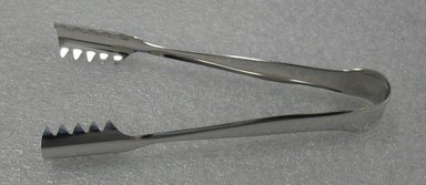 Luigi Massoni. <em>Ice Tongs</em>, designed 1952. Stainless steel, 3/4 x 3 x 6 1/4 in. (1.9 x 7.6 x 15.9 cm). Brooklyn Museum, Gift of Alessi S.p.A., 1999.40.9. Creative Commons-BY (Photo: Brooklyn Museum, CUR.1999.40.9.jpg)