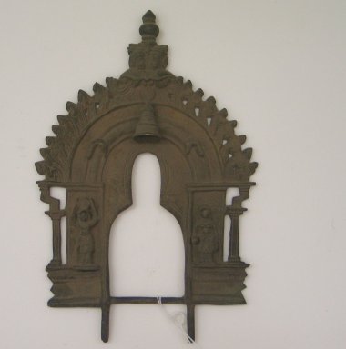 Jain. <em>Small Perforated Arched Screen for an Image of Brass</em>, 18th century. Brass, 10 1/8 x 6 11/16 in. (25.7 x 17 cm). Brooklyn Museum, Robert B. Woodward Memorial Fund, 20.17. Creative Commons-BY (Photo: Brooklyn Museum, CUR.20.17_front.jpg)
