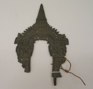 Jain. <em>Small Perforated Arched Screen for an Image of Brass</em>, 18th century. Brass, 6 7/8 x 4 1/2 in. (17.4 x 11.5 cm). Brooklyn Museum, Robert B. Woodward Memorial Fund, 20.18. Creative Commons-BY (Photo: Brooklyn Museum, CUR.20.18_front.jpg)