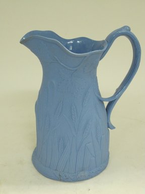 Edward Walley, Villa Pottery (1845–1865). <em>Jug, Ceres Pattern</em>, Patented April 26th 1851. Matte blue stoneware, 7 7/8 x 5 3/4 x 5 1/4 in.  (20.0 x 14.6 x 13.3 cm). Brooklyn Museum, Gift of Gretchen Adkins, 2000.126.4. Creative Commons-BY (Photo: Brooklyn Museum, CUR.2000.126.4_view2.jpg)