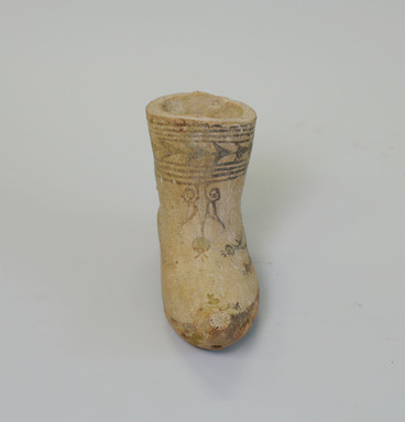  <em>Shoe-shaped Vessel</em>, 4th-5th century. Terracotta with iron slip decoration, 3 13/16 x 6 x 1 3/4 in. (9.7 x 15.2 x 4.5 cm). Brooklyn Museum, Gift of Shirley Day, 2000.12. Creative Commons-BY (Photo: Brooklyn Museum, CUR.2000.12_view2.jpg)