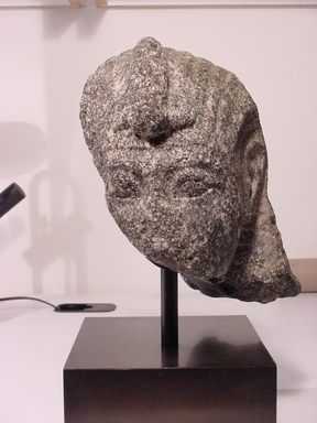  <em>Fragmentary Head of A King, probably Ramesses II</em>, ca. 1279-1213 B.C.E. Gray granite, 7 11/16 x 6 7/8 x 9 1/16 in.  (19.5 x 17.5 x 23.0 cm). Brooklyn Museum, Partial gift of James Lamb in honor of Paul O'Rourke and Charles Edwin Wilbour Fund, 2001.56. Creative Commons-BY (Photo: Brooklyn Museum, CUR.2001.56_view01.jpg)