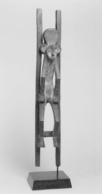 Mbole. <em>Male Okifa Figure with Stretcher</em>, late 20th century. Wood, kaolin, traces of tukula powder, 22 5/8 x 3 5/8 x 3 5/8in. (57.5 x 9.2 x 9.2cm). Brooklyn Museum, Gift of Dr. Werner Muensterberger, 2001.81. Creative Commons-BY (Photo: Brooklyn Museum, CUR.2001.81_print_front_bw.jpg)
