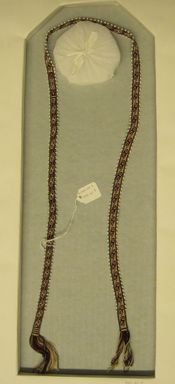 Quechua. <em>Woven Tie (Wato)</em>, 2002. Alpaca fleece, sheep wool, glass(?) beads, natural dyes, 1/2 × 43 in. (1.3 × 109.2 cm). Brooklyn Museum, Frank Sherman Benson Fund, 2002.62.5. Creative Commons-BY (Photo: Brooklyn Museum, CUR.2002.62.5_view01.jpg)