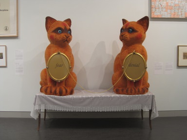 Pepón Osorio (Puerto Rican, born  1955). <em>Fear and Denial</em>, 1997. Mixed media, 92 x 96 x 32 in. (233.7 x 243.8 x 81.3 cm). Brooklyn Museum, Bequest of William K. Jacobs, Jr., by exchange, 2003.5. © artist or artist's estate (Photo: Brooklyn Museum, CUR.2003.5_installation.jpg)