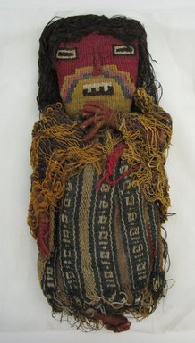 Chancay. <em>Funerary Doll</em>, ca. 1100–1350. Cotton and dyed camelid (alpaca?) fiber and reeds, 4 x 9 1/2 in. (10.2 x 24.1 cm). Brooklyn Museum, Gift of Eric Jacobsen, 2003.81.3. Creative Commons-BY (Photo: Brooklyn Museum, CUR.2003.81.3.jpg)