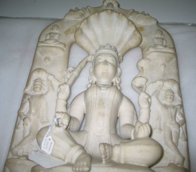  <em>Seated Divinity Surrounded by Tirthankaras</em>, 15th century. White marble, 29 1/8 x 13 9/16 x 5 5/16 in. (74 x 34.5 x 13.5 cm). Brooklyn Museum, Gift of Dr. Alvin E. Friedman-Kien, 2004.112.21. Creative Commons-BY (Photo: Brooklyn Museum, CUR.2004.112.21_detail1.jpg)