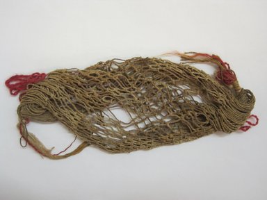 Chancay. <em>Two-Cornered, Netted Hat</em>, 1000-1476. Camelid fiber, cotton, 3 x 6 in. (7.6 x 15.2 cm). Brooklyn Museum, Gift of Victor P. Nunez, 2004.53.10. Creative Commons-BY (Photo: Brooklyn Museum, CUR.2004.53.10.jpg)