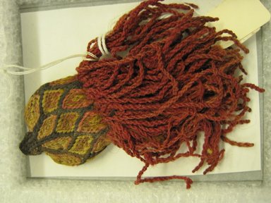 Chancay. <em>Tassel or Decorative Element</em>, 1000-1476. Camelid fiber, 4 1/2 × 2 1/2 × 1/4 in. (11.4 × 6.4 × 0.6 cm). Brooklyn Museum, Gift of Victor P. Nunez, 2004.53.37. Creative Commons-BY (Photo: , CUR.2004.53.37_view01.jpg)