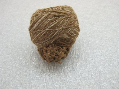 Possibly Chimú. <em>Cone of Brown and White Yarn</em>, 1100-1450. Corn cob, cotton, 2 x 1 3/4 x 1 1/2 in. (5.1 x 4.4 x 3.8 cm). Brooklyn Museum, Gift of Victor P. Nunez, 2004.53.48. Creative Commons-BY (Photo: , CUR.2004.53.48_view01.jpg)