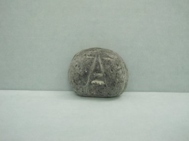 Inuit. <em>Miniature Head in Relief</em>, 1950-1980. Gray stone, 2 x 2 1/2 x 1/2 in. (5.1 x 6.4 x 1.3 cm). Brooklyn Museum, Hilda and Al Schein Collection, 2004.79.15. Creative Commons-BY (Photo: Brooklyn Museum, CUR.2004.79.15.jpg)