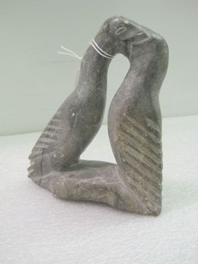 Inuit. <em>Two Loons, One Feeding the Other</em>, 1950-1980. Gray stone, 6 1/4 x 5 1/2 x 2 1/8 in. (15.9 x 14 x 5.4 cm). Brooklyn Museum, Hilda and Al Schein Collection, 2004.79.23. Creative Commons-BY (Photo: , CUR.2004.79.23.jpg)