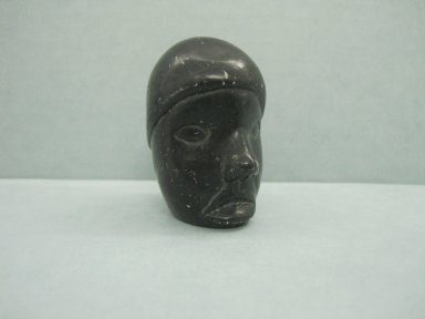 Inuit. <em>Miniature Human Head</em>, 1950-1980. Black stone, 2 1/2 x 1 3/8 x 1 7/8 in. (6.4 x 3.5 x 4.8 cm). Brooklyn Museum, Hilda and Al Schein Collection, 2004.79.26. Creative Commons-BY (Photo: Brooklyn Museum, CUR.2004.79.26.jpg)