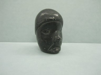 Inuit. <em>Miniature Human Head</em>, 1950–1980. Black stone, 2 1/2 x 1 3/8 x 1 7/8 in. (6.4 x 3.5 x 4.8 cm). Brooklyn Museum, Hilda and Al Schein Collection, 2004.79.26. Creative Commons-BY (Photo: Brooklyn Museum, CUR.2004.79.26.jpg)