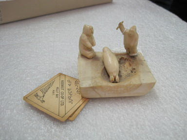 Inuit. <em>Scene: Two Hunters with Seal</em>, 1950-1980. Ivory, bone, pigment, 2 1/8 x 2 3/4 x 2 3/4 in. (5.4 x 7 x 7 cm). Brooklyn Museum, Hilda and Al Schein Collection, 2004.79.41. Creative Commons-BY (Photo: , CUR.2004.79.41.jpg)