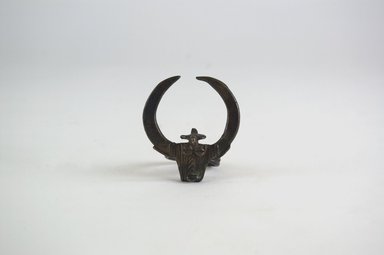 Bwa. <em>Ring with Bovine Head and Bird</em>, 19th century. Copper alloy, ring: 1 3/16 in. (3 cm). Brooklyn Museum, Gift of Dr. Werner Muensterberger and Michael Ward, 2006.66.5. Creative Commons-BY (Photo: Brooklyn Museum, CUR.2006.66.5_front_PS5.jpg)
