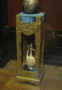  <em>Pedestal</em>, ca. 1885. Wood, gesso, gilt, other pigment, original (?) silk velvet textile, modern cotton trim, leather, glass, metal upholstery tacks, 40 3/4 x 15 x 15 in. (103.5 x 38.1 x 38.1 cm). Brooklyn Museum, Gift of Robert Tuggle, 2006.69. Creative Commons-BY (Photo: Brooklyn Museum, CUR.2006.69_in_situ.jpg)