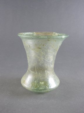  <em>Beaker</em>, 6th-7th century. Green glass, Height: 3 5/8 in. (9.2 cm) . Brooklyn Museum, Gift of Wunsch Americana Foundation, Inc., 2006.81.2. Creative Commons-BY (Photo: Brooklyn Museum, CUR.2006.81.2.jpg)