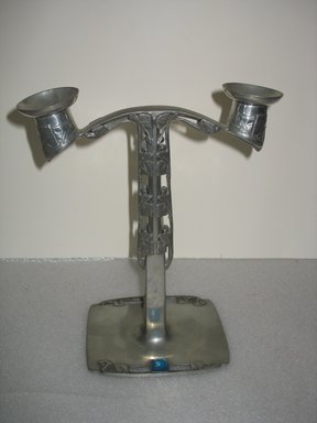 Archibald Knox (English, 1864–1933). <em>Candlestick, One of Pair</em>, Registered 1905. Pewter, enamel, 11 x 9 1/2 x 5 in. (27.9 x 24.1 x 12.7 cm). Brooklyn Museum, Gift of the Estate of Dr. Eleanor Z. Wallace, 2007.41.7a-c. Creative Commons-BY (Photo: Brooklyn Museum, CUR.2007.41.7a-c.jpg)