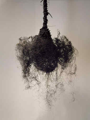 Petah Coyne (American, born 1953). <em>Untitled #698 (Trying to Fly, Houdini's Chandelier)</em>, 1991. Mixed media, 60 x 36 x 27 in., 10 lb. (152.4 x 91.4 x 68.6 cm, 4.5kg). Brooklyn Museum, Gift of the Rothfeld Family Collection in memory of Harriet Weill Rothfeld 

, 2008.17.1. © artist or artist's estate (Photo: Image courtesy of the donor, CUR.2008.17.1_donor_photograph.jpg)