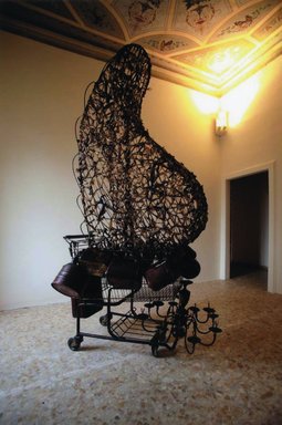Nari Ward (Jamaican, born 1963). <em>Crusader</em>, 2005. Plastic bags, metal, shopping cart, trophy elements, tar extract, chandelier, plastic containers, a - top: 71 x 22 x 52 in. (180.3 x 55.9 x 132.1 cm). Brooklyn Museum, Purchased with funds given by Giulia Borghese, 2008.52.1a-b. © artist or artist's estate (Photo: Image courtesy of Deitch Projects, CUR.2008.52.1_Deitch_Projects_photograph.jpg)