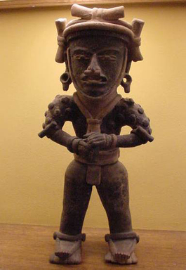 Veracruz. <em>Standing Warrior Figure</em>, ca. 200–500 C.E. Ceramic, pigment from plant saps, resins, crushed plants, asphalt, and black soot, 21 1/2 x 9 1/2 x 5 3/4 in. (54.6 x 24.1 x 14.6 cm). Brooklyn Museum, Gift of the Coltrera Collection, 2010.23.3. Creative Commons-BY (Photo: Brooklyn Museum, CUR.2010.23.3.jpg)