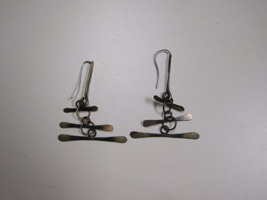 Art Smith (American, born Cuba, 1917–1982). <em>Pair of Earrings</em>, ca. 1960. Brass and silver, 2 3/4 x 1 15/16 x 1/2 in. (7.0 x 4.9 x 1.3 cm). Brooklyn Museum, Gift of Jacqueline Loewe Fowler, 2010.26a-b. Creative Commons-BY (Photo: Brooklyn Museum, CUR.2010.26a-b.jpg)