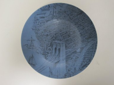 Susan Doban (American, born 1958). <em>Plate "The City of Brooklyn- Brooklyn Bridge,"</em> Designed and manufactured 2010. Porcelain, 7/8 x 8 3/8 in. (2.2 x 21.3 cm). Brooklyn Museum, Gift of Susan Doban for Think Fabricate, 2010.30.3. Creative Commons-BY (Photo: Brooklyn Museum, CUR.2010.30.3.jpg)