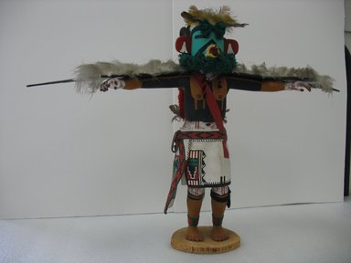 probably Henry Shelton (1929–2016). <em>Kachina Doll (Kwahu [Eagle])</em>, 1960–1970. Cottonwood root, acrylic pigment, feathers, yarn, leather, 19 1/2 x 27 x 5 in. (49.5 x 68.6 x 12.7 cm). Brooklyn Museum, Gift of Edith and Hershel Samuels, 2010.6.13. Creative Commons-BY (Photo: Brooklyn Museum, CUR.2010.6.13.jpg)