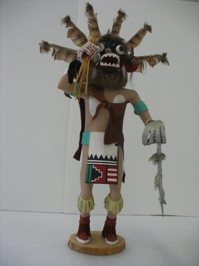 Probably Henry Shelton (1929-2016). <em>Ogre (Chaveyo) Kachina Doll</em>, 1960-1970. Cottonwood root, acrylic pigment, hide, feathers, fur, horse hair, wood, yarn, 23 x 13 1/2 x 10 in. (58.4 x 34.3 x 25.4 cm). Brooklyn Museum, Gift of Edith and Hershel Samuels, 2010.6.15. Creative Commons-BY (Photo: Brooklyn Museum, CUR.2010.6.15.jpg)