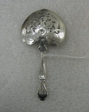 Gorham Manufacturing Company (1865-1961). <em>Sweet Meat Server</em>, ca. 1900. Silver, 5 1/8 x 2 1/2 x 3/4 in. (13 x 6.4 x 1.9 cm). Brooklyn Museum, Gift of William Lee Younger in memory of Joseph A. Henehan, 2010.77.11. Creative Commons-BY (Photo: Brooklyn Museum, CUR.2010.77.11_back.jpg)