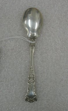 A. A. Webster & Co.. <em>Ice Cream Spoon</em>, ca. 1900. Silver, 5 3/4 x 1 3/16 x 1/2 in. (14.6 x 3 x 1.3 cm). Brooklyn Museum, Gift of William Lee Younger in memory of Joseph A. Henehan, 2010.77.6. Creative Commons-BY (Photo: Brooklyn Museum, CUR.2010.77.6_back.jpg)
