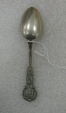  <em>"Brooklyn" Souvenir Spoon</em>, ca. 1935. Silver, 5 3/4 x 1 1/4 x 7/8 in. (14.6 x 3.2 x 2.2 cm). Brooklyn Museum, Gift of William Lee Younger in memory of Joseph A. Henehan, 2010.77.9. Creative Commons-BY (Photo: Brooklyn Museum, CUR.2010.77.9_back.jpg)