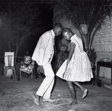 Malick Sidibé (Malian, 1935 or 1936-2016). <em>Nuit de Noël (Happy Club)</em>, 1972/2011. Gelatin silver photograph, Image: 24 x 24 in. (61 x 61 cm). Brooklyn Museum, Frederick Loeser Fund and Alfred T. White, 2011.67.1. © artist or artist's estate (Photo: Image courtesy of L. Parker Stephenson Photographs, New York City, CUR.2011.67.1_Parker_Stephenson_Gallery_photo.jpg)