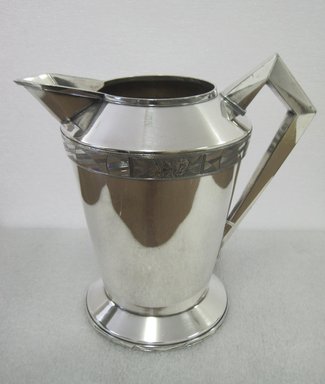 Albert F. Saunders (1878–1964). <em>Pitcher, "Modernistic" Line</em>, 1928. Silverplate, 8 1/4 x 9 x 8 in. (21 x 22.9 x 20.3 cm). Brooklyn Museum, Gift of Ravi R. Mathura in memory of Milo, 2011.82. Creative Commons-BY (Photo: Brooklyn Museum, CUR.2011.82.jpg)