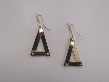 Art Smith (American, born Cuba, 1917–1982). <em>Pair of Earrings</em>, 1975. Gold, 2 x 15/16 x 7/8 in. (5.1 x 2.4 x 2.2 cm). Brooklyn Museum, Gift of Linda Kandel Kuehl in loving memory of her husband, John R. Kuehl, 2011.89.1a-b. Creative Commons-BY (Photo: Brooklyn Museum, CUR.2011.89.1a-b.jpg)