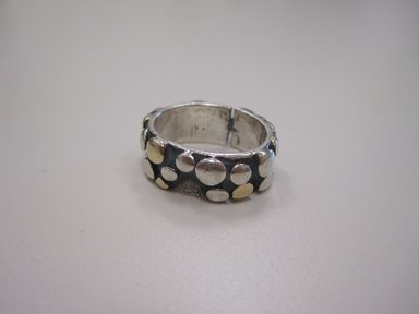 Art Smith (American, born Cuba, 1917-1982). <em>Woman's Wedding Ring</em>, 1974. Gold and Sterling Silver, 1/4 x 7/8 in. (0.6 x 2.2 cm). Brooklyn Museum, Gift of Linda Kandel Kuehl in loving memory of her husband, John R. Kuehl, 2011.89.2. Creative Commons-BY (Photo: Brooklyn Museum, CUR.2011.89.2.jpg)